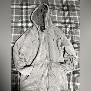 Selling grey polo zip up hoodie. Amazing for the winter and it’s fashionable